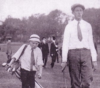 A photo of 1913 US Open winner Francis Ouiment and his caddie Eddie heading to the 1st tee for the 1913 US Open playoff.