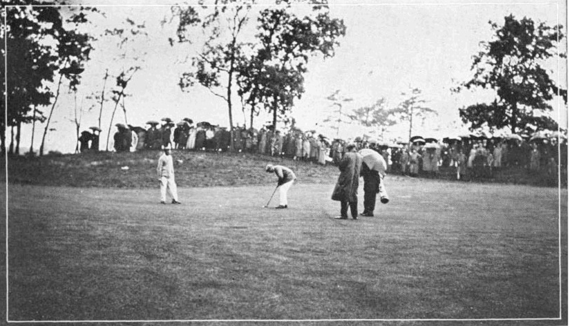 A photo Francis Ouimet putting on the 8th green during the 1913 US Open.