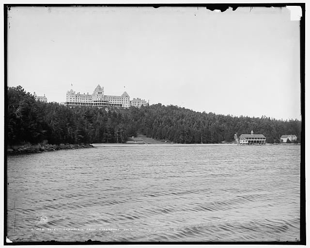 View of the Hotel Champlain,beach and boat house from D & H steamship landing. 1890