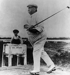 A photo of President Taft playing golf.