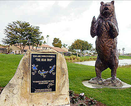 A photo of the signage beginning 'The Bear Trap' on the Champions golf course