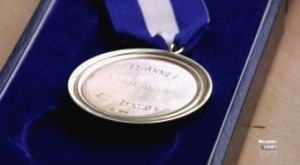 A photo of the 2012 Open Championship Medal with the wrong name scribed ready to engrave.